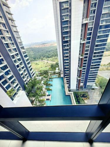 a view of a pool from a window in a building at B2107 Grand Medini Pool View 100ms Netflix By STAY in Iskandar Puteri