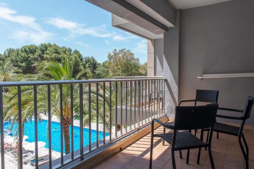 a balcony with a view of a swimming pool at Bordoy Cosmopolitan in Playa de Palma
