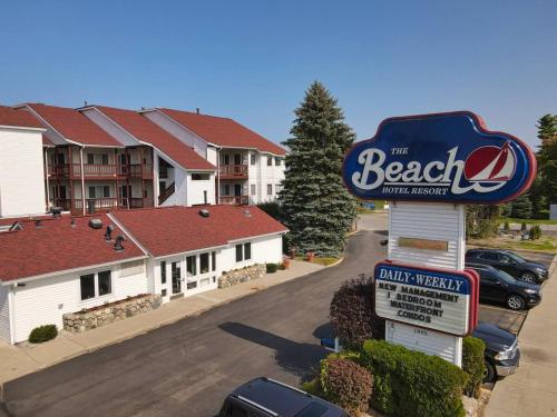a sign in a parking lot in front of a motel at Surreal Views #328 Beach Pool AC Hot Tub in Traverse City