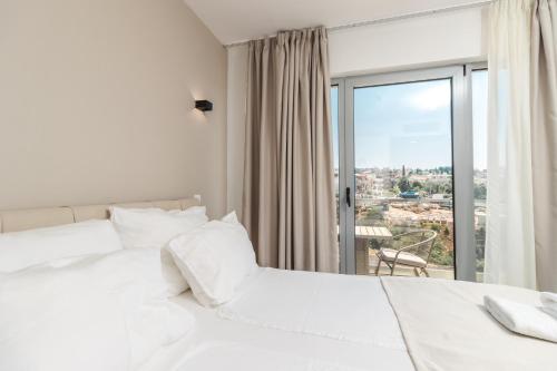 Vuode tai vuoteita majoituspaikassa Lux Hotel M