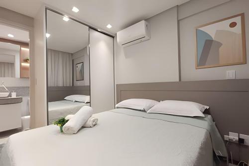 Ένα ή περισσότερα κρεβάτια σε δωμάτιο στο Requinte e Conforto a Beira Mar - by TRH Home Stay