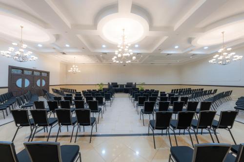 a large room with rows of chairs and chandeliers at Hotel El Panama by Faranda Grand, a member of Radisson Individuals in Panama City