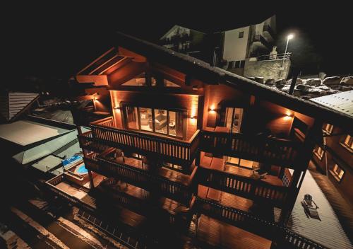 a building with lights on top of it at night at La Cresta Chalet in Breuil-Cervinia