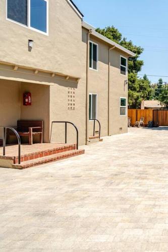 a house with a porch and a patio at 1 Palo Alto - Fully Furnished, AC, Private, Parking & Laundry in East Palo Alto