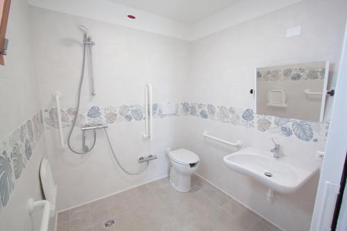 a bathroom with a shower and a toilet and a sink at AgriCamping Ca' Bodi in Cavallino-Treporti