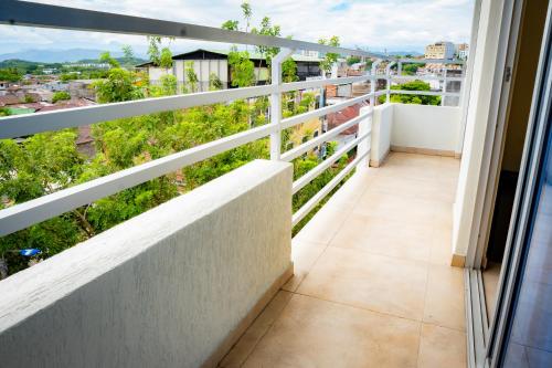 a balcony with a view of a city at KALINA HOTEL in Girardot