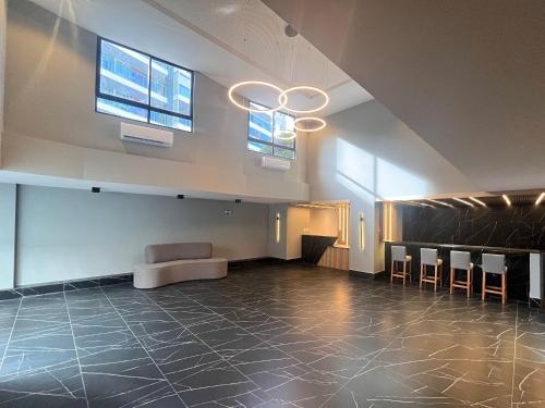 a large room with a stage and a chandelier at Flat Premium Legacy Suites - Cabo Branco in João Pessoa