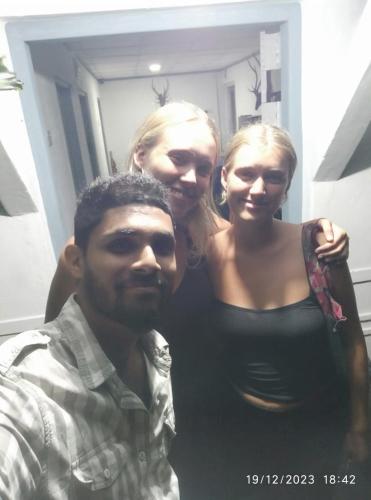 a man and a woman standing in front of a mirror at Digital Nomads in Weligama