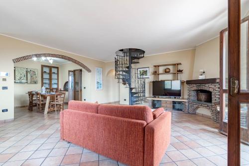 a living room with a couch and a fireplace at H11 OASI SERENA Parcheggio-Giardino in Taggia