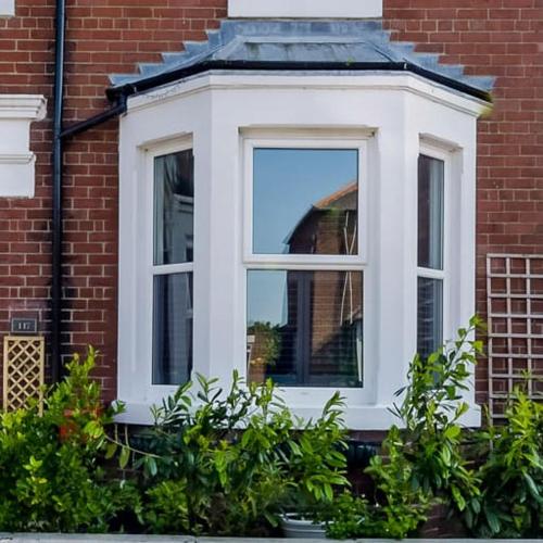 a window on the side of a brick building at Oneonesevenns Coastal Property in North Shields