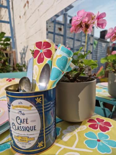 a can of cafe cassotide next to a potted plant at Oneonesevenns Coastal Property in North Shields