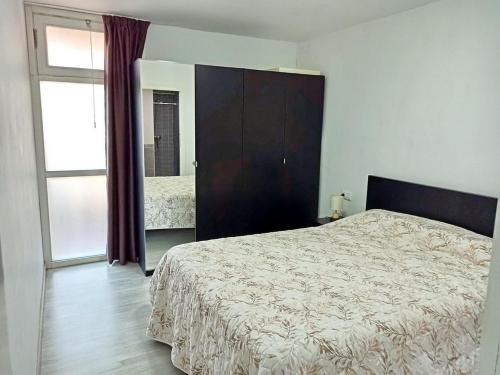 Ένα ή περισσότερα κρεβάτια σε δωμάτιο στο COMFORTABLE APARTMENT ON THE 1st SEA LINE IN THE SOUTH OF TENERIFE