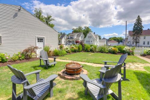 a yard with chairs and a fire pit at Port Clinton Home with Lake View - Walk to Beach! in Port Clinton