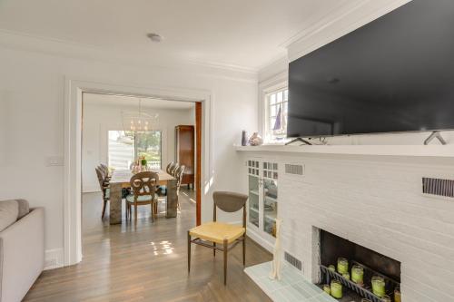a living room with a fireplace and a table at Port Clinton Home with Lake View - Walk to Beach! in Port Clinton