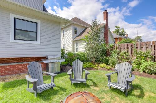 three chairs and a table in a yard at Port Clinton Home with Lake View - Walk to Beach! in Port Clinton