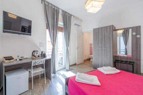 Postel nebo postele na pokoji v ubytování Cavour Rooms
