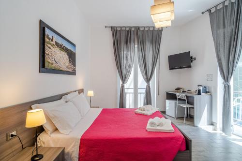 Postel nebo postele na pokoji v ubytování Cavour Rooms