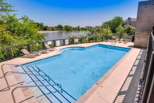 a swimming pool on a balcony with a view of a river at Riverfront Retreat in Nashville