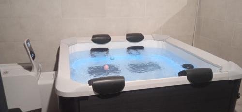 a bath tub with two people in it in a bathroom at Casa Rita-Superior Room in Giarre