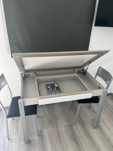 a desk with two chairs in front at Villa Amir in Fuengirola
