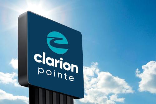 a sign for a clapton polluting gas station at Clarion Pointe - Fort Worth Arlington West in Fort Worth