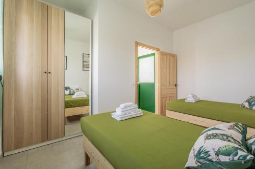 Postel nebo postele na pokoji v ubytování Casa Cactus