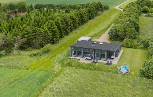 an overhead view of a house in a field at Cozy Home In Kalundborg With Kitchen in Kalundborg