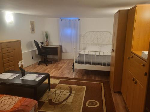 a small room with a bed and a desk at Grzegorzecka Room 3 in Kraków