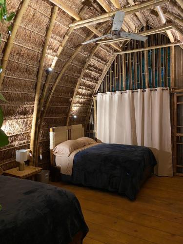 a bedroom with two beds in a room at Casa Lorette in Martínez