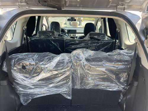 an open trunk of a car covered in plastic at Trio villa with falls in compound فلا بحديقة كبيره وشلالات صناعية in Sheikh Zayed
