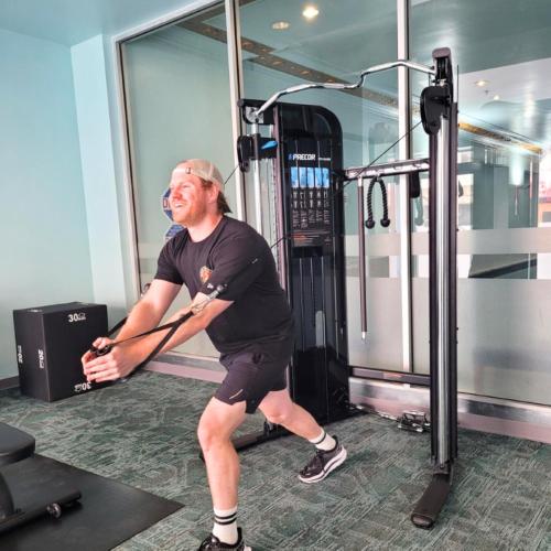 a man standing in a gym holding a bat at Marines' Memorial Club & Hotel Union Square in San Francisco
