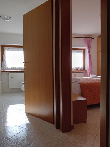 Postel nebo postele na pokoji v ubytování Alloggio la Falesia