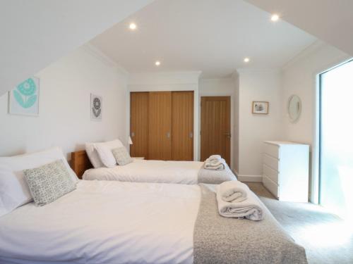 En eller flere senge i et værelse på Crabapple Cottage, Southwold