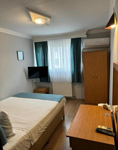 Ένα ή περισσότερα κρεβάτια σε δωμάτιο στο Elite Hotel City Center Corlu Bed and Breakfast