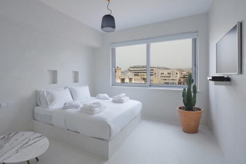 Postel nebo postele na pokoji v ubytování Athens Penthouse Aparthotel