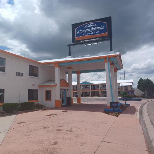 a gas station with a sign on top of it at Howard Johnson by Wyndham Springerville in Springerville