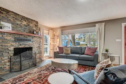 a living room with a couch and a fireplace at Blackstone Trails Downtown w BBQ & Fire Pit in Colorado Springs