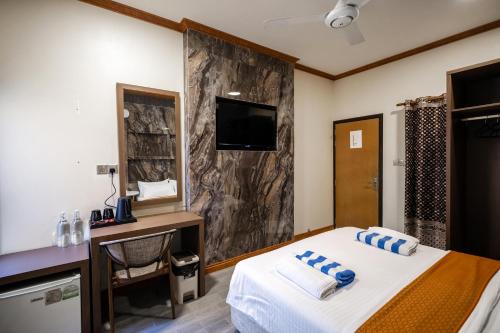 Cama o camas de una habitación en Bibee Maldives