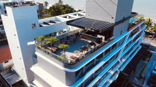 an aerial view of a building with a swimming pool at Icon Hotel by Welkom in João Pessoa