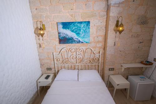 Postel nebo postele na pokoji v ubytování Kybele Suites Alaçatı