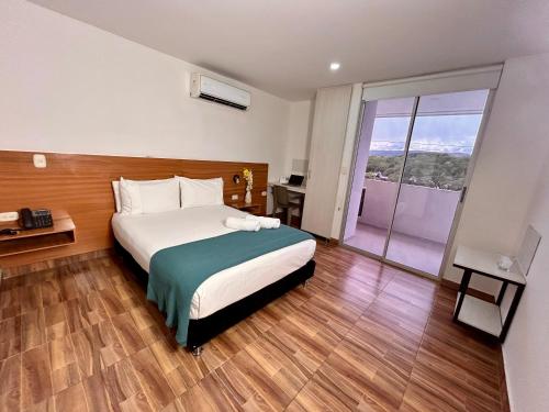 Una cama o camas en una habitación de Hotel Berdez