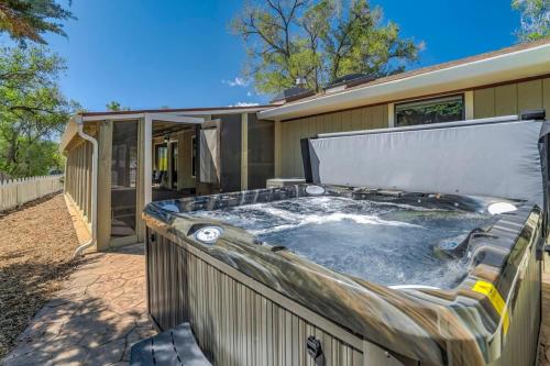 a hot tub in the backyard of a house at Pinewood Meadow & Scenic Hot Tub & BBQ & Outdoors in Colorado Springs