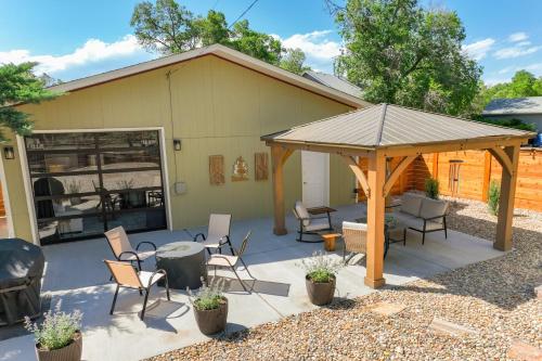 a patio with chairs and a gazebo at Pinewood Sanctuary Secluded & Peaceful OCC Oasis in Colorado Springs