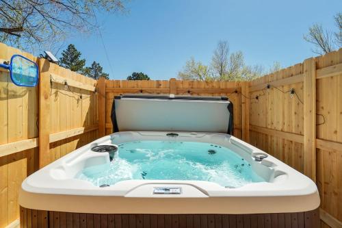 a hot tub on a wooden fence at Rockies Rainbow Road Hot Tub Pikes Peak Views Pac Man in Colorado Springs