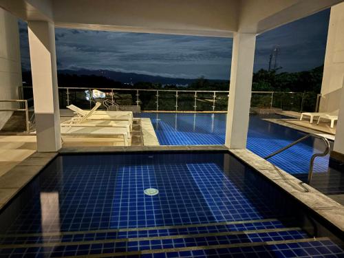 a swimming pool on the roof of a building at Ocean Garden Villas, Boracay New Coast in Boracay