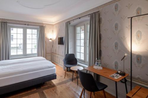 Postel nebo postele na pokoji v ubytování Resort Schloss Rued