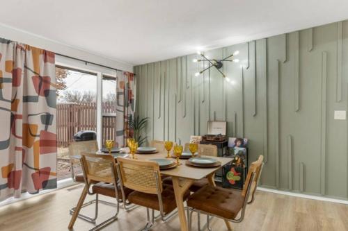 a dining room with a table and chairs at Tulsa Funk House in Tulsa