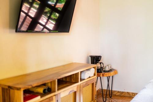a room with a wooden shelf and a window at Portales del Tayrona Garden Hotel in Calabazo