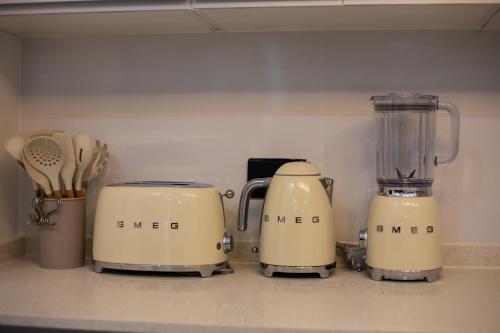 two toasters and a blender on a kitchen counter at Gracimor Hyndland Estate in Lusaka