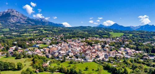 an aerial view of a small town in the mountains at Le Sapin in Chabottes